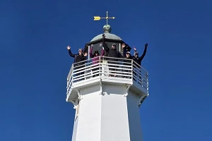 NTC atop Boulder Bank Lighthouse July 2026 web